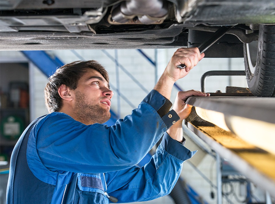 Mechanic inspecting underneath a vehicle - Car Repairs York