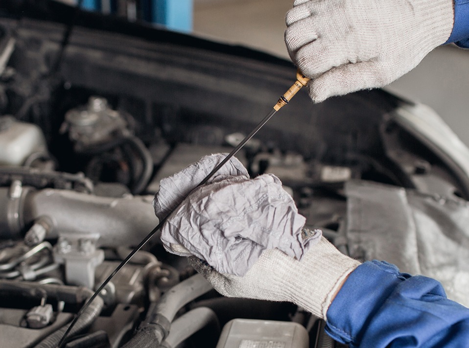 Mechanic cleaning the engine stick - Car Servicing York